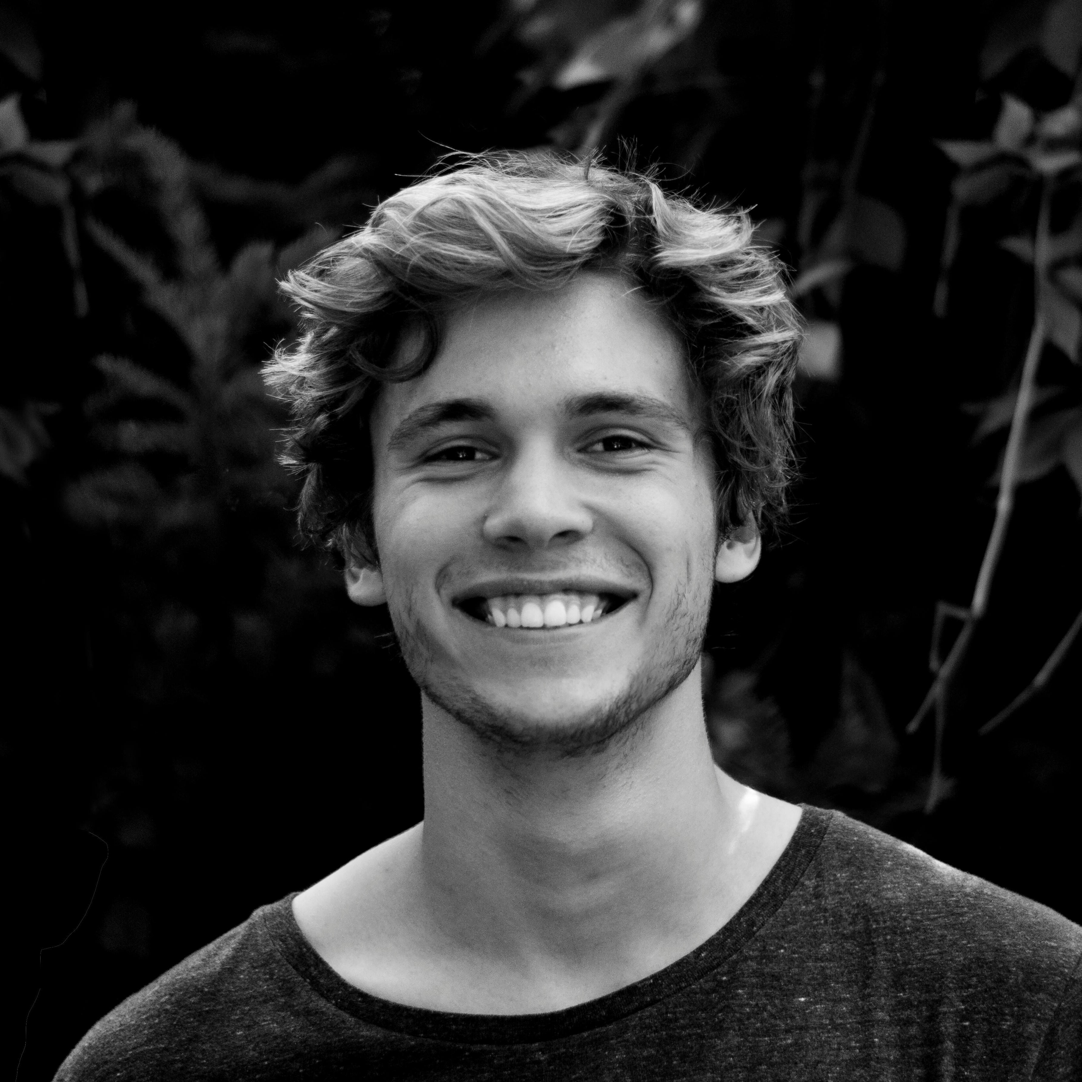 photo of a boy smiling at the camera