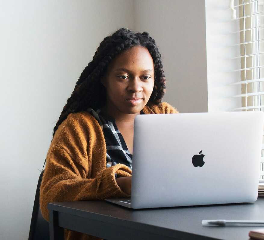 a person looking a laptop